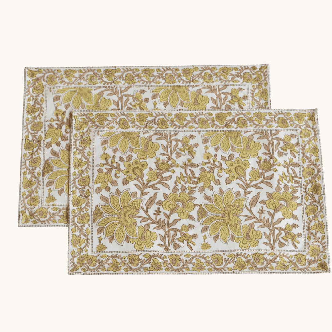 Two floral patterned placemats on a white background
