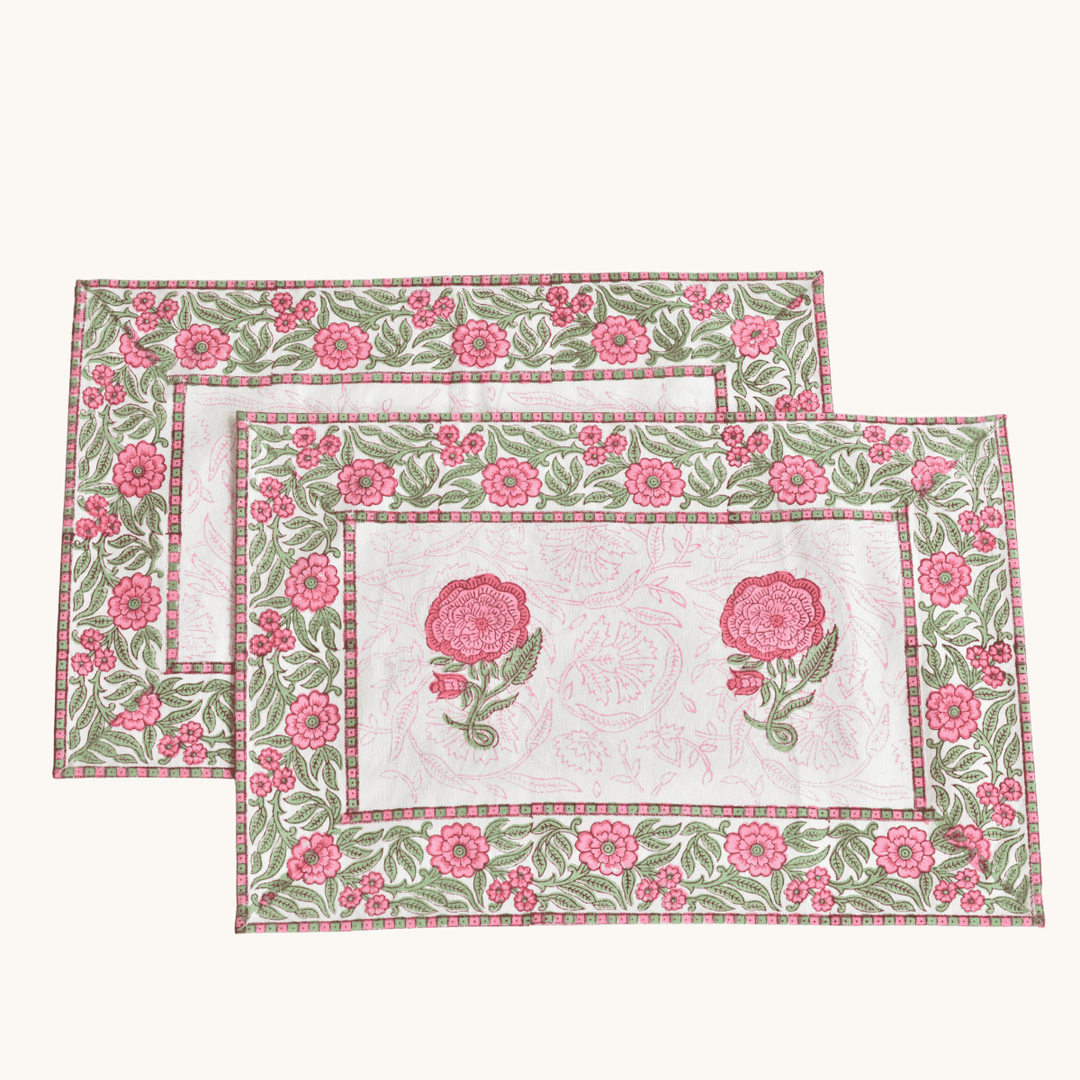 Set of two floral placemats with pink flowers on a white background