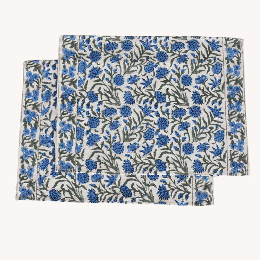 Rectangular cotton placemats with hand block printed blue floral pattern.