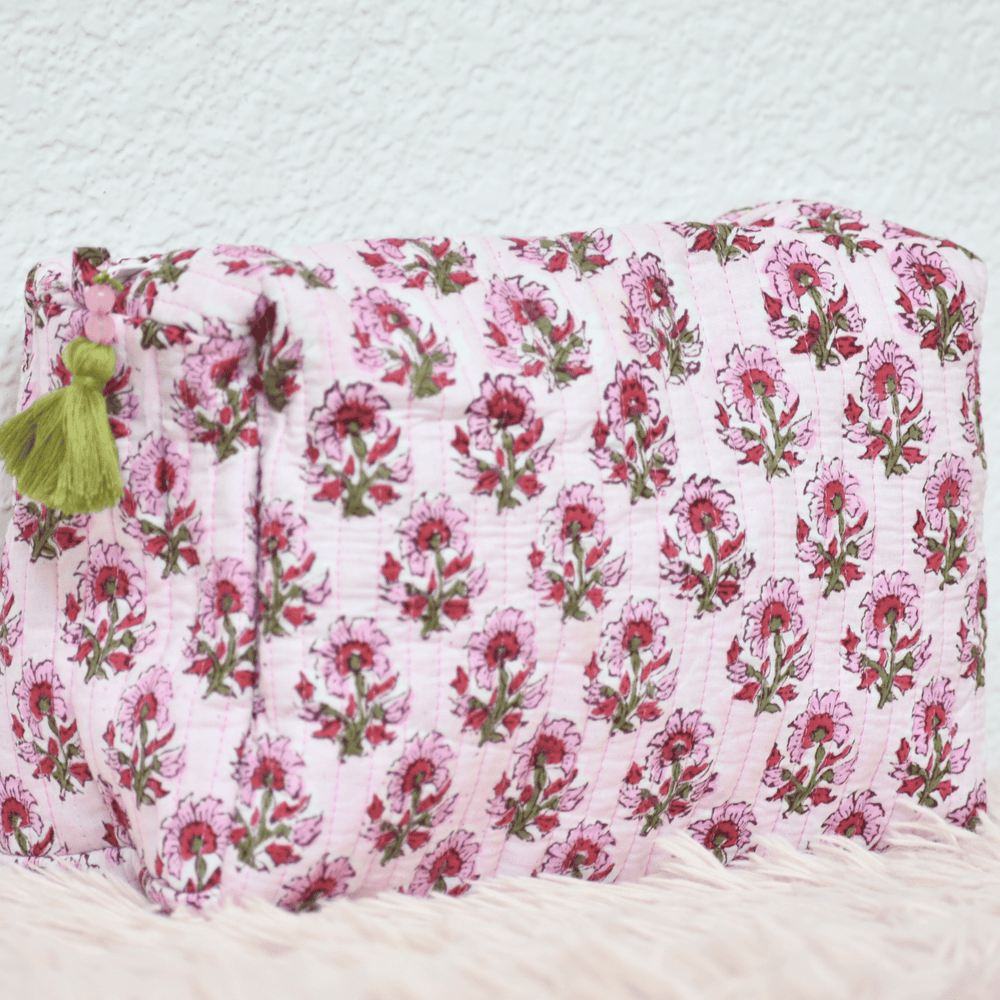 Floral-patterned pouch with pink flowers on a white background
