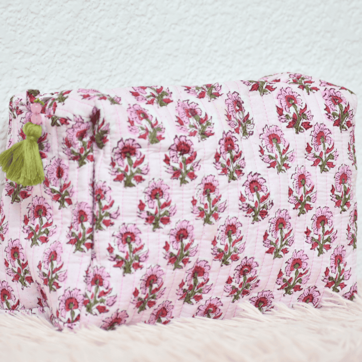 Floral-patterned pouch with pink flowers on a white background