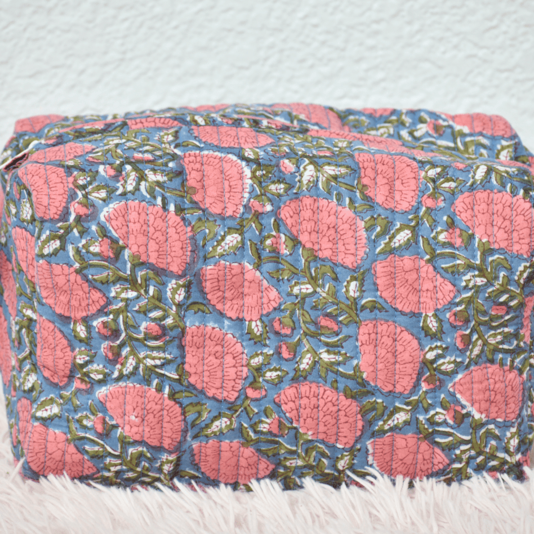 Floral patterned ottoman on a light blue background